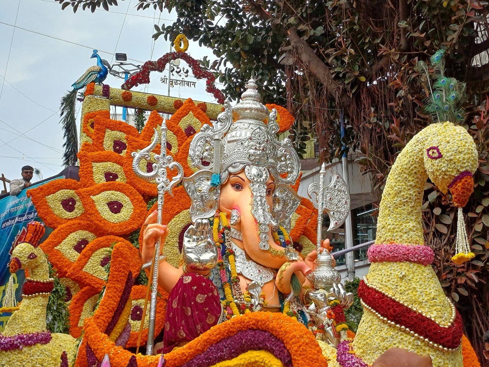 Tulshibaug Ganpati on its flower-decorated visarjan float